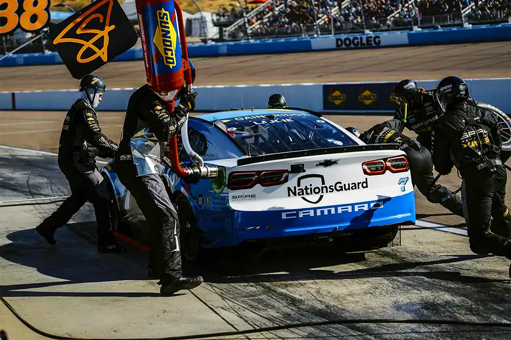 Racecar at pitstop with Sunoco branded fuels